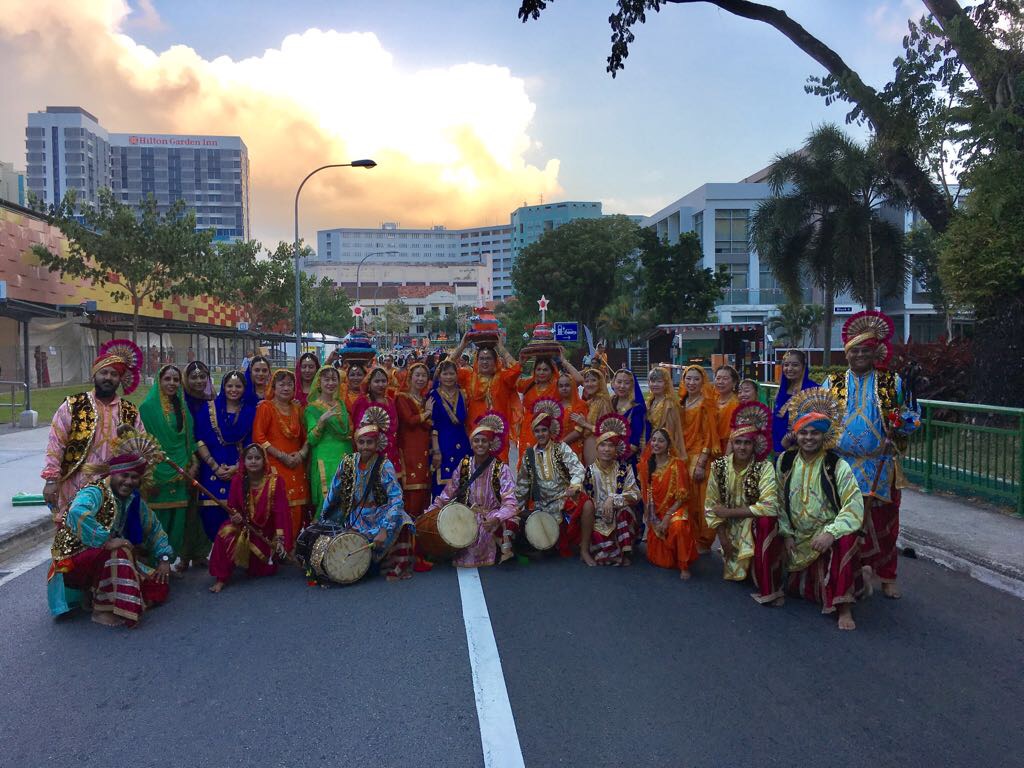 Bhangre De Sitare's bhangra group posing with the dhol.