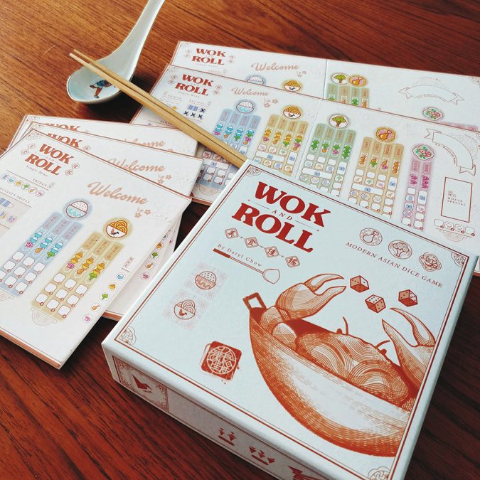 An overview shot of Singaporean board game, Wok and Roll, and its contents.
