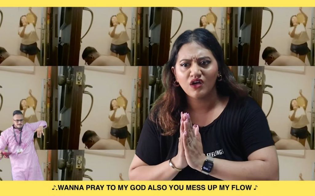 A still image from 'BUCK IT UP - K. MUTHUSAMY' with the lyrics "Wanna pray to my god also you mess up my flow". Preetipls and Subhas in frame.